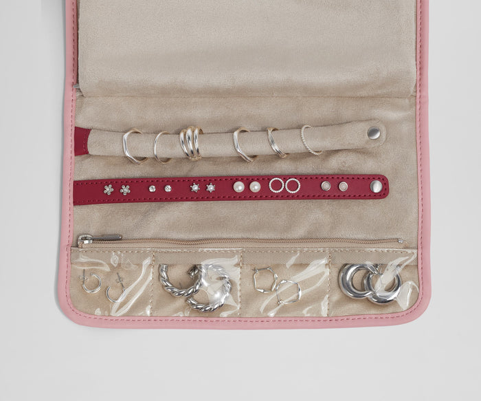 Close up view of the compartments and two padded holders for earrings and rings